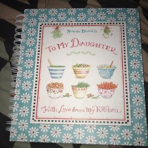 Mothers cooking book to daughter